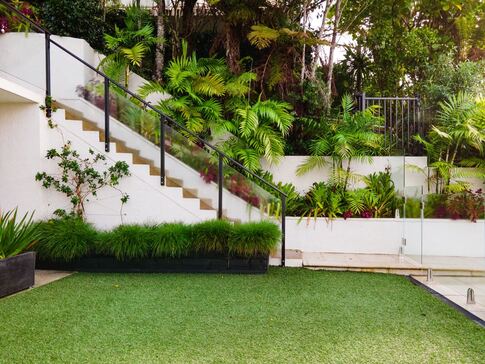 Residential backyard with artificial turf lawn